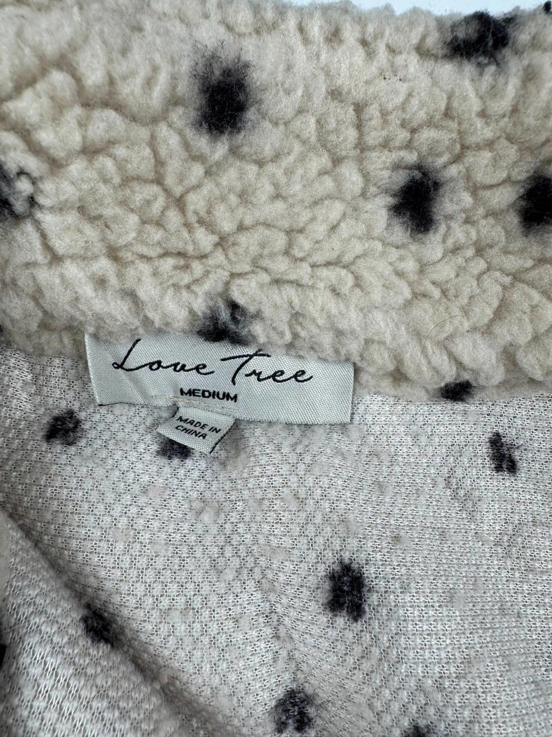 Vintage Fleece Jacket with Zip-Up Collar and Patterned Design